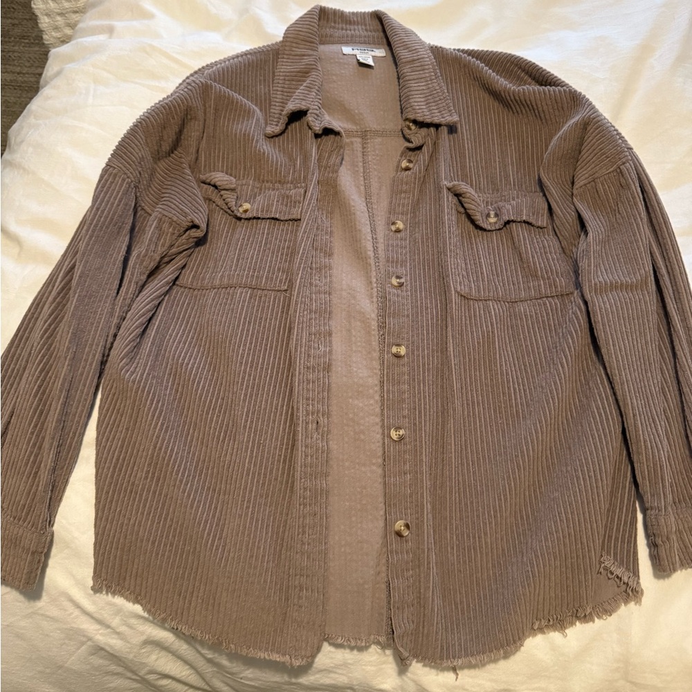 Medium brown button down shirt.